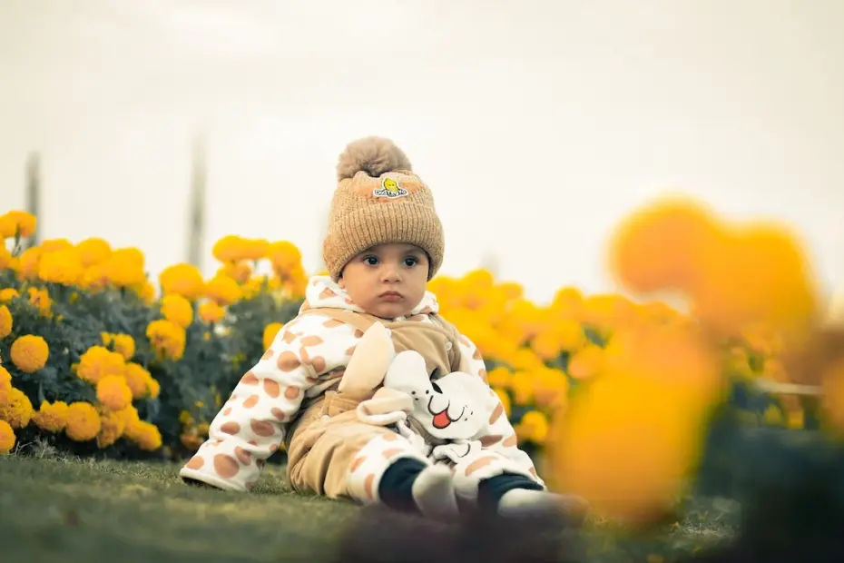 baby in midst of flowers