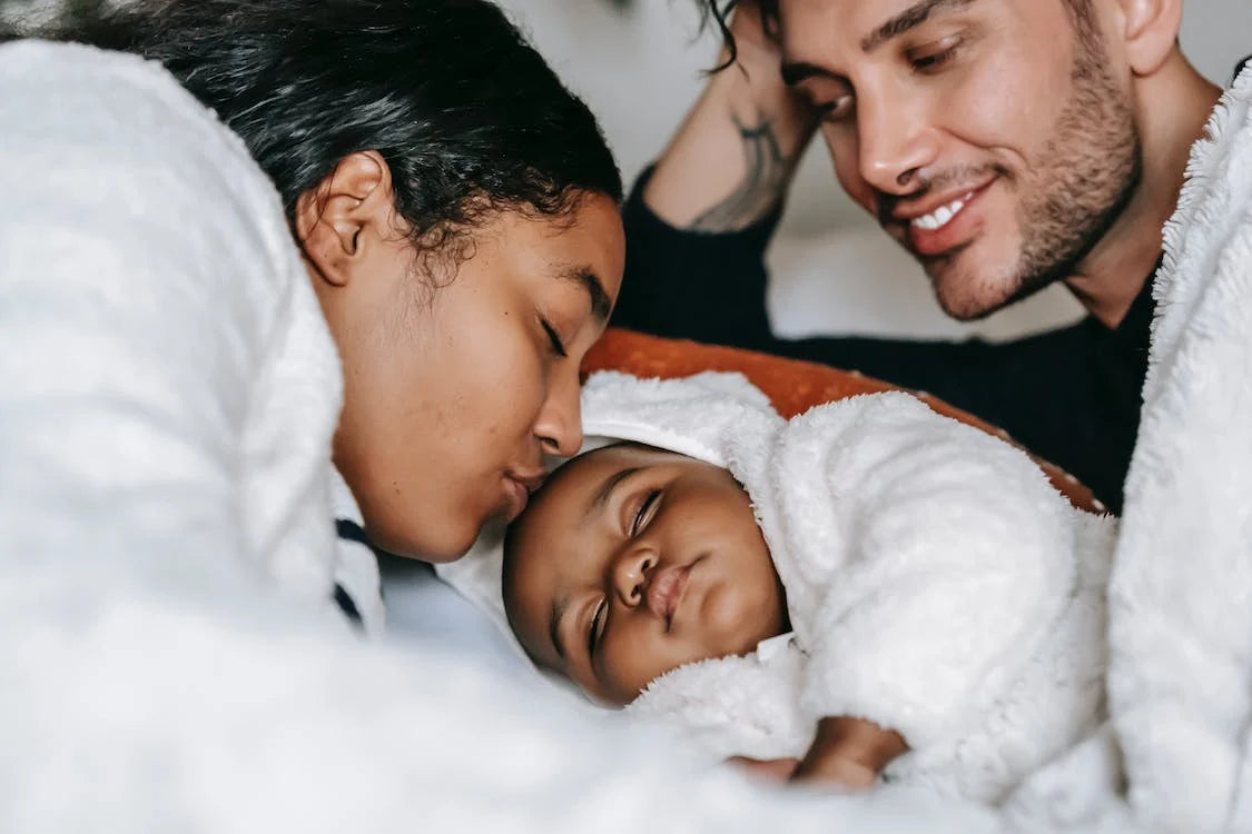 calm baby with happy parents